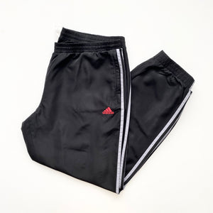 Black with red hot sale stripe adidas pants